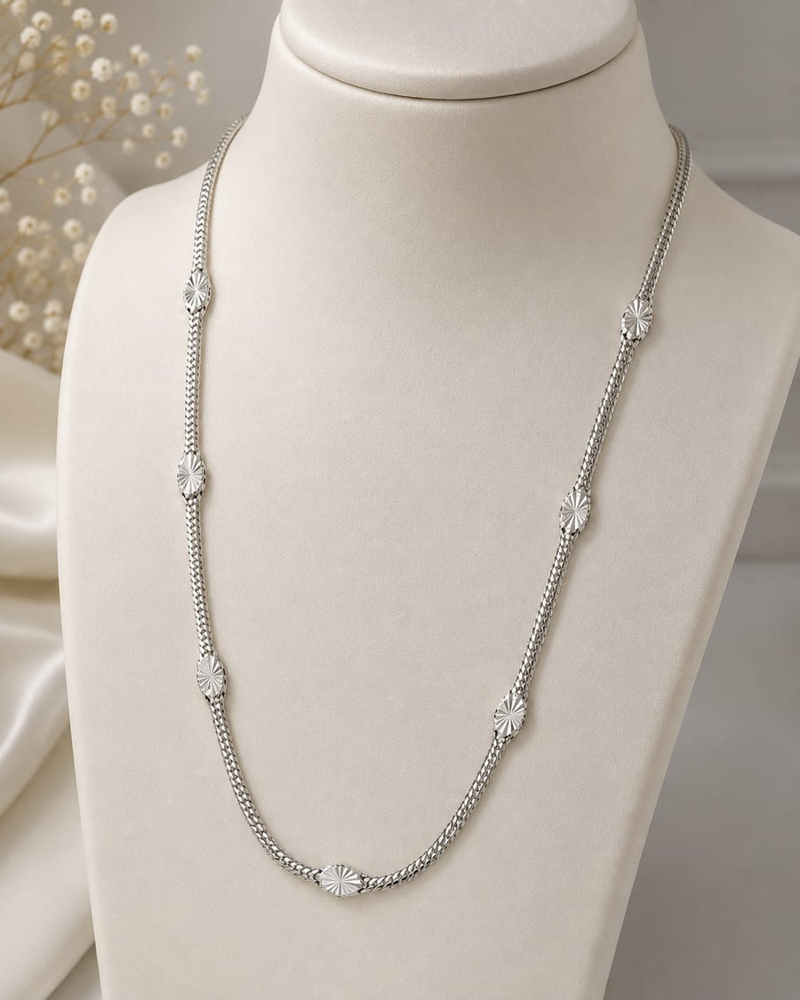 Silver textured link long chain necklace on jewellery display
