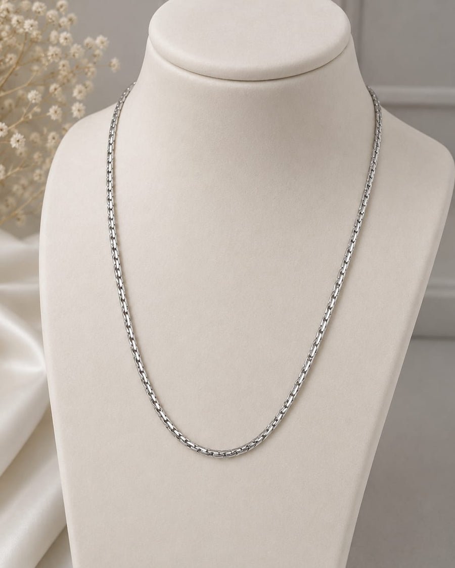 Silver minimalist classic chain necklace on white jewellery bust