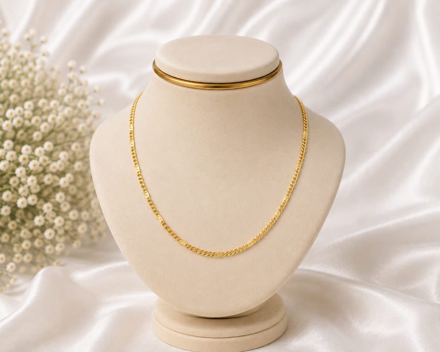 Gold classic link chain necklace on white jewellery display